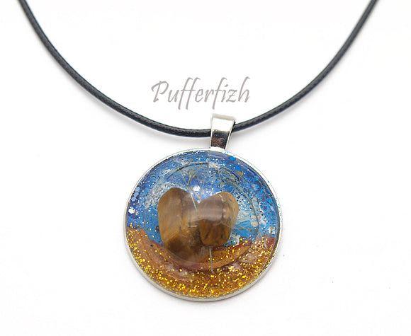 Stone with dried flower cast in resin pendent with matching cord
